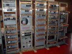 Five vertical racks of antique electronics