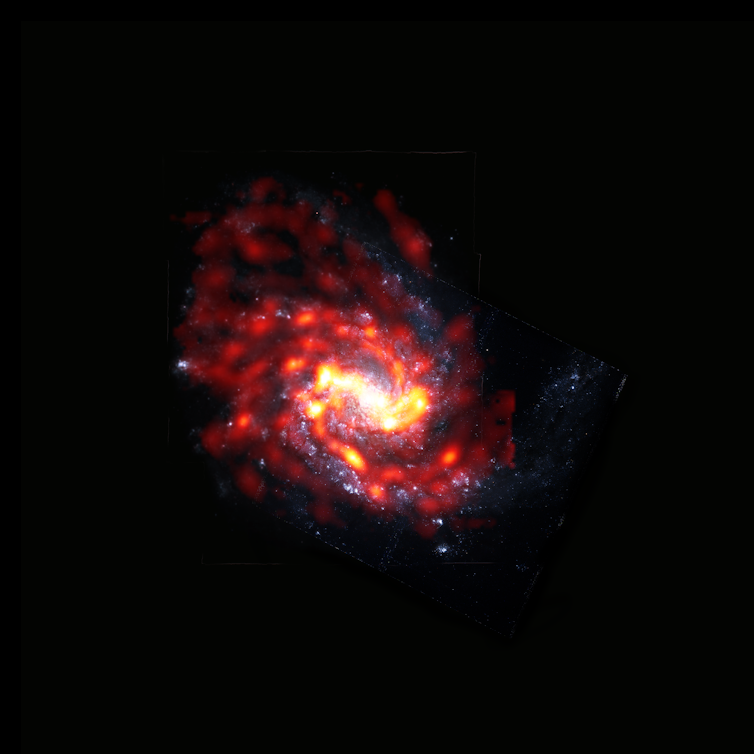 a striking image of an orange spiral galaxy on a dark background