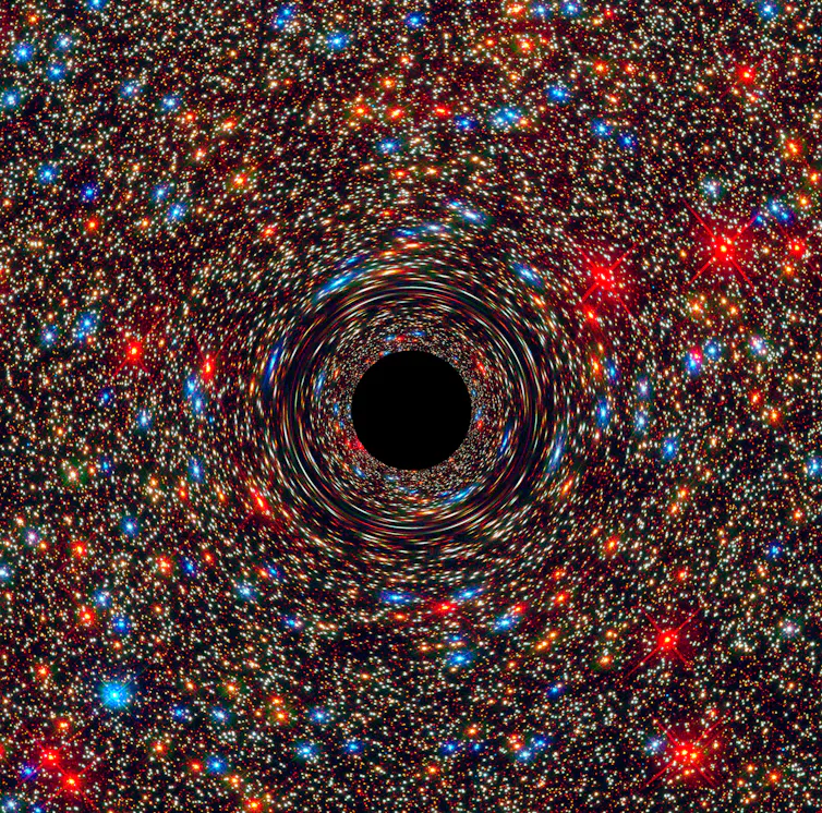 Black circle at centre of points of light
