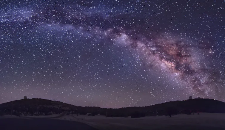 Night sky with ribbon of cloud and light