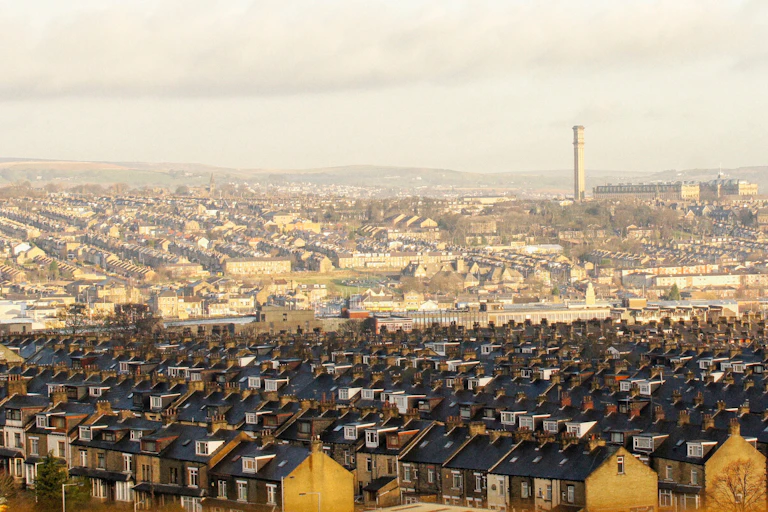 Aerial view of terraced houses and old industrial building