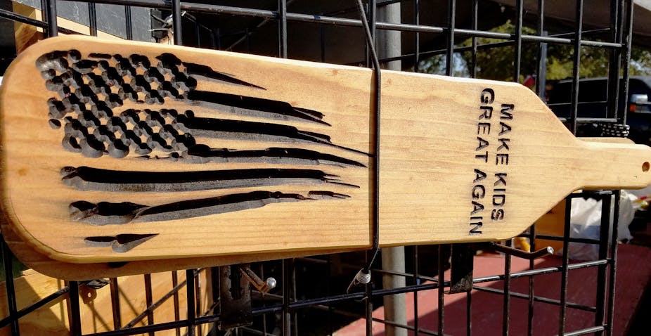 A spanking paddle to discipline children with the words "Make Kids Great Again".