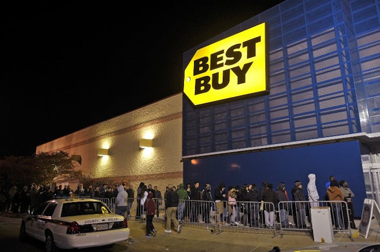 A Best Buy store with a queue outside