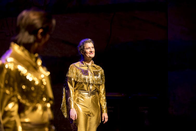 Production image: Virgina Gay in gold