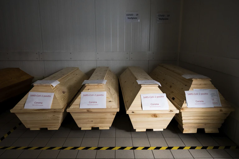coffins labelled corona