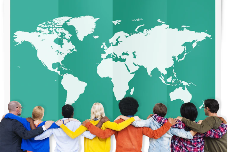 A row of students looking back at a map of the world