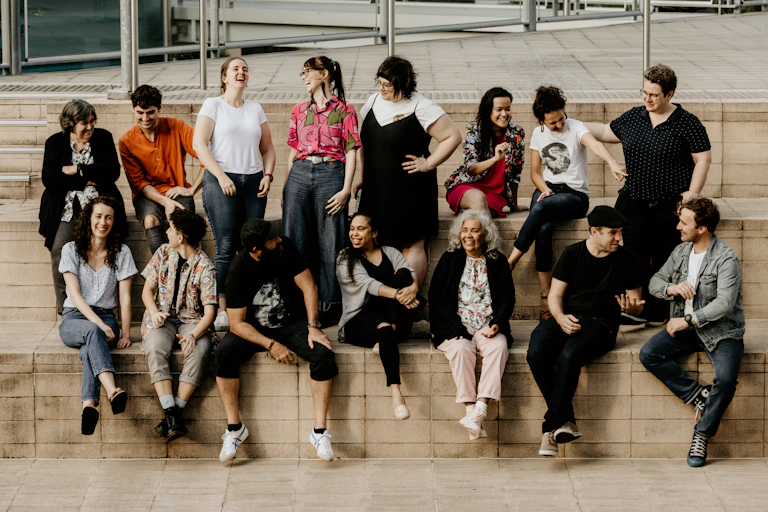 A group of diverse people similing