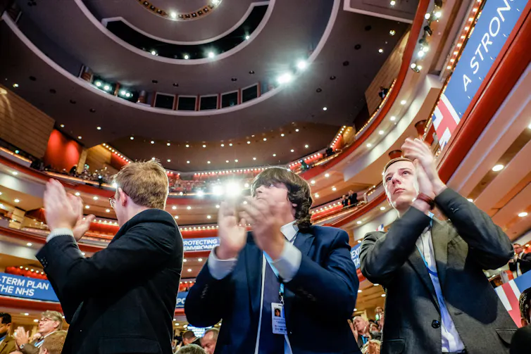 Young Conservatives applaud at the Conservative Party Conference in October 2018