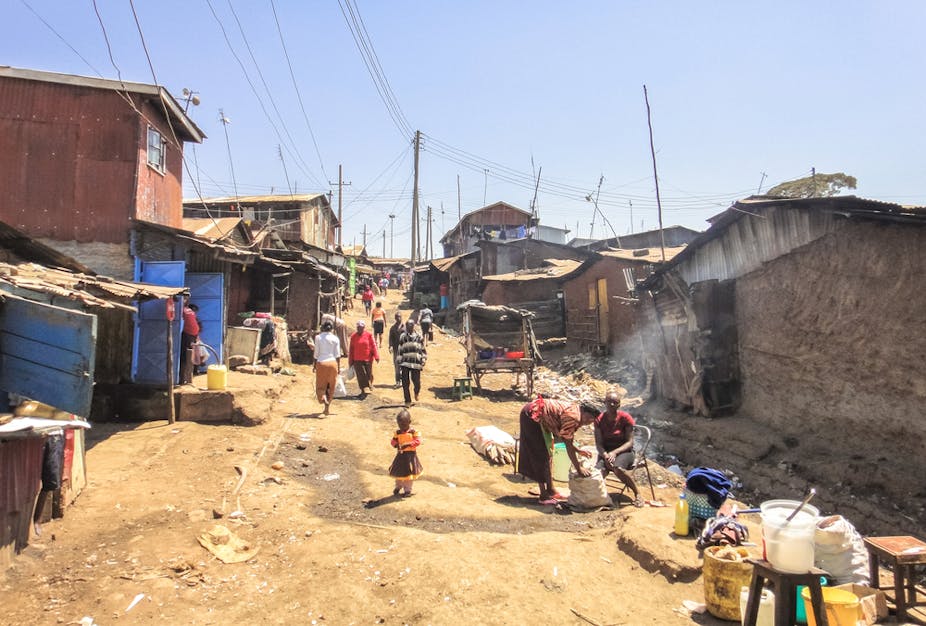 People going about daily life in an urban slum.