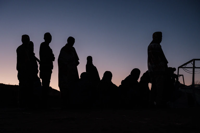Refugees queue for contributions