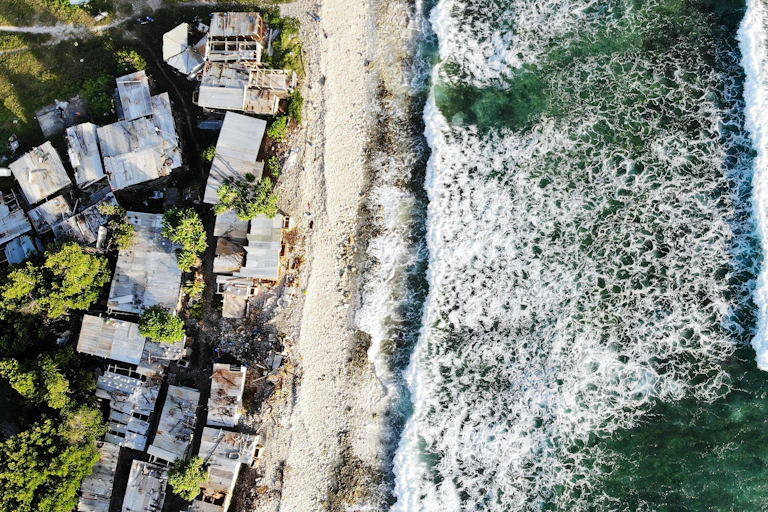 Houses in Tuvalu, the world’s fourth-smallest country, where the sea rises by five millimeters each year, driving flooding, storm surges, saltwater intrusion and coastal erosion.