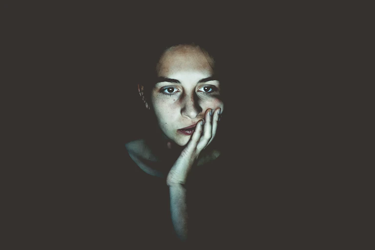 woman looks tired and worried