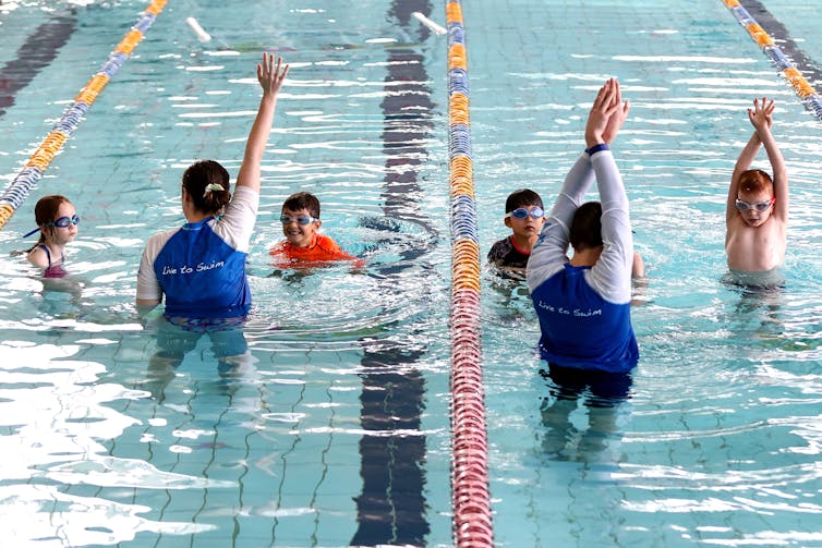 Kids in a swimming class