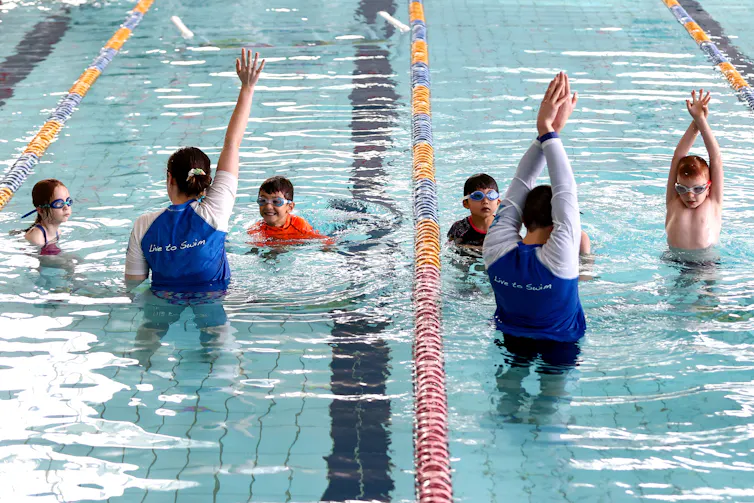 Kids in a swimming class
