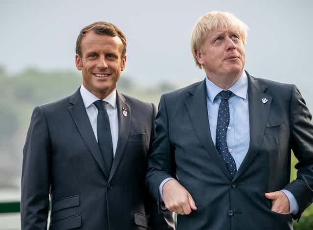 Emmanuel Macron and Boris Johnson posing for a photo in Cornwall.
