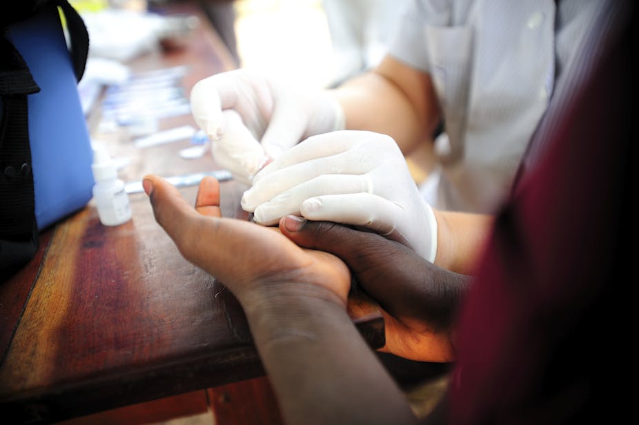 close up of hand being prepared for HIV test