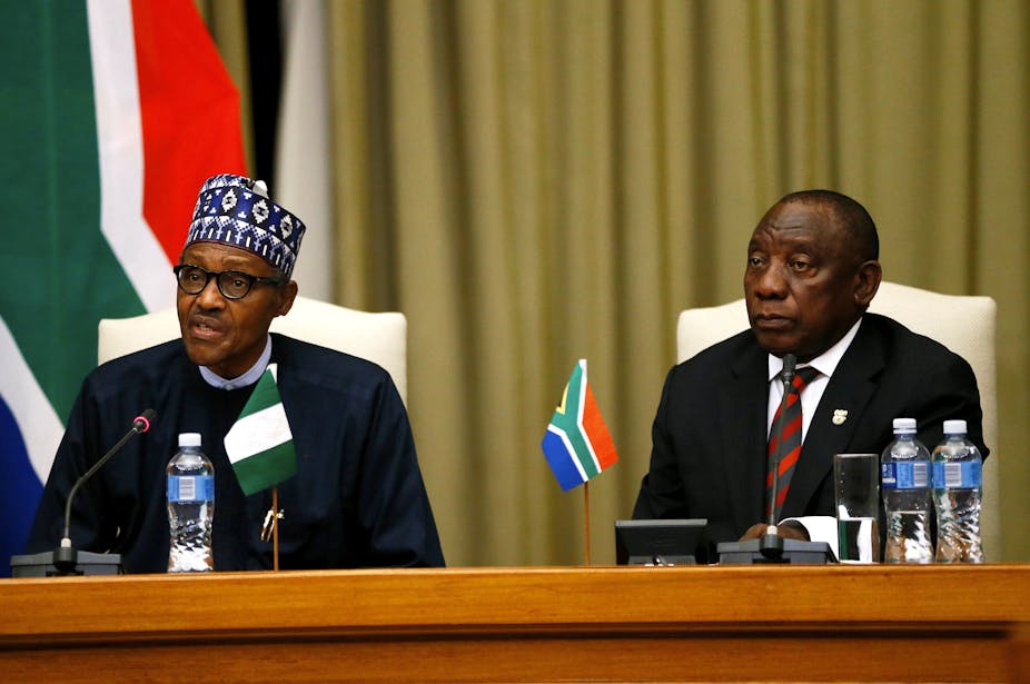 Nigeria's President Muhammadu Buhari (L) and South Africa's President Cyril Ramaphosa give their opening remarks during his official state visit at Union Buildings in Pretoria, on October 3, 2019