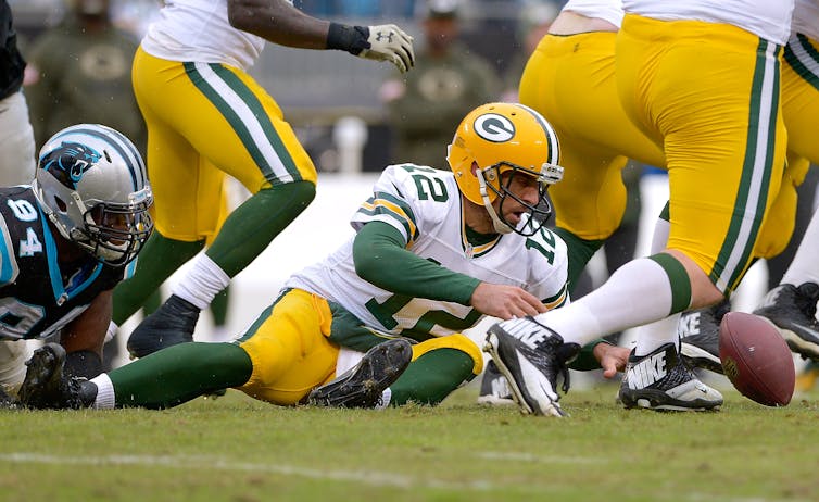 Rodgers on the ground post-fumble with football out of reach