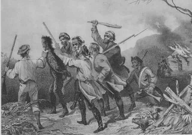 Men in colonial garb beating a government official with sticks