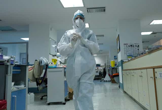 A doctor in PPE in a COVID ward