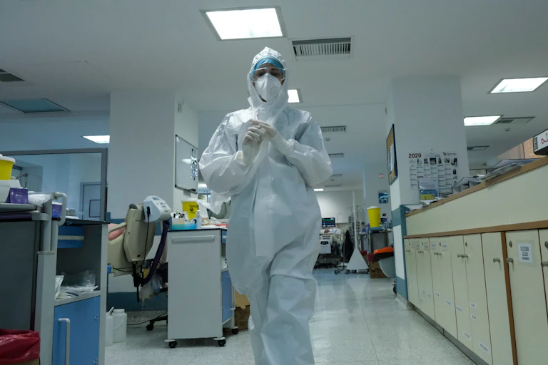 A doctor in PPE in a COVID ward