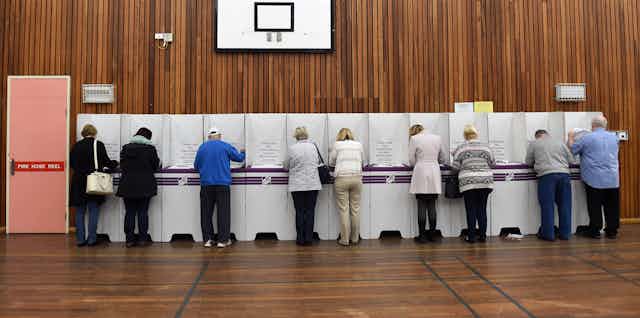 Voters cast their ballots in the seat of Lindsay, for Federal Election in Sydney, Saturday, July 2, 2016.