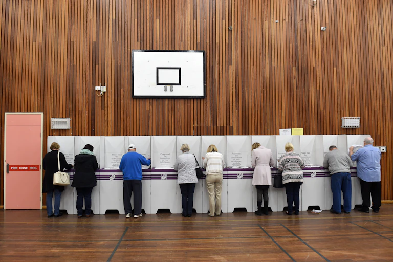 Voters cast their ballots in the seat of Lindsay, for Federal Election in Sydney, Saturday, July 2, 2016.