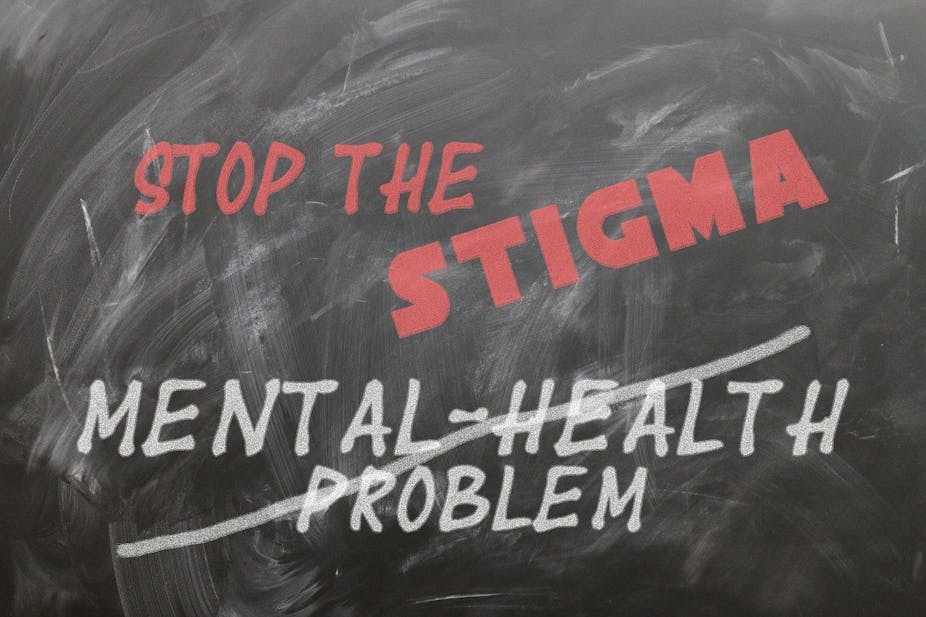A blackboard with the phrase stop the stigma