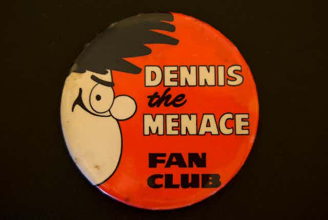 A Dennis the Menace badge.