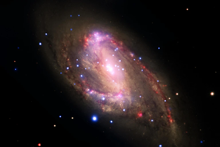 A spiral shaped galaxy with a bright spot in the centre