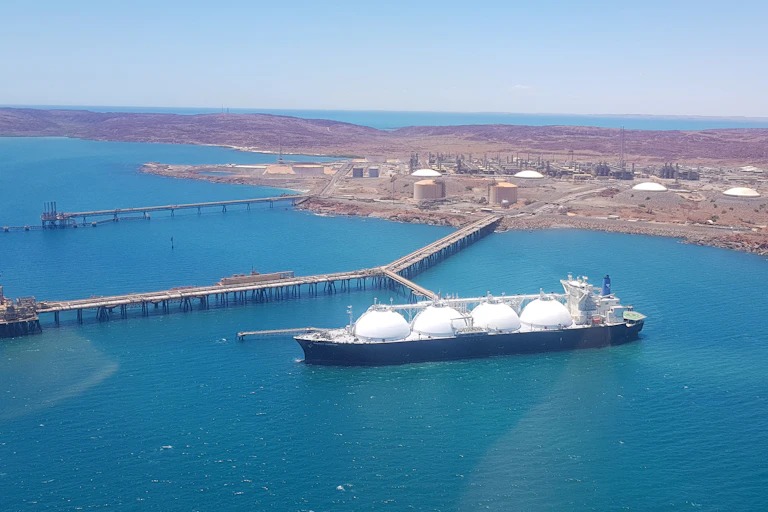 ship docked at gas plant