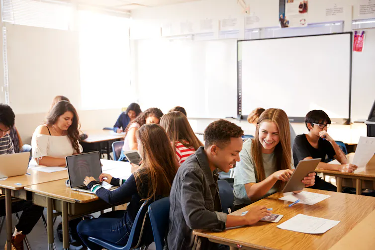 Classroom of teenage boys and girls