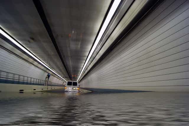 A van in a flooded tunnel