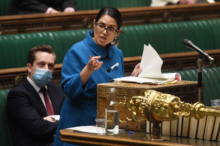 Priti Patel standing at the dispatch box in the House of Commons.