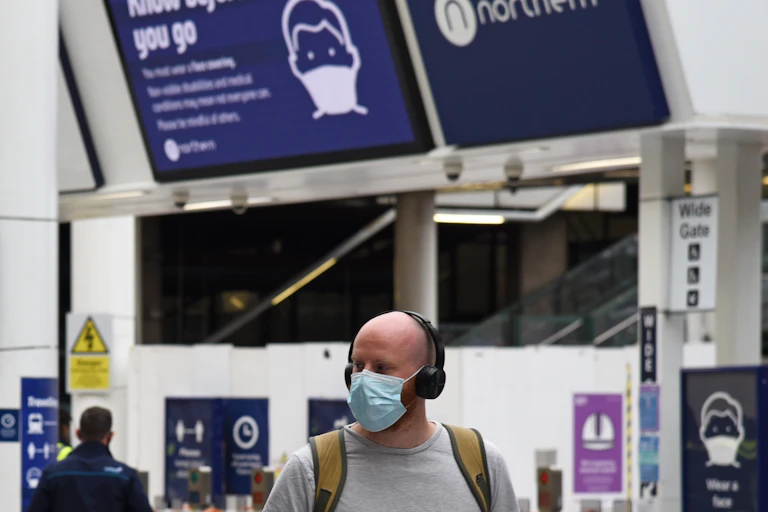 A man in a train station during the pandemic.