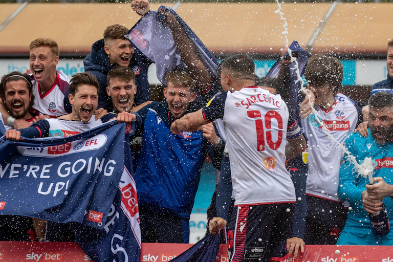 Footballers celebrating.