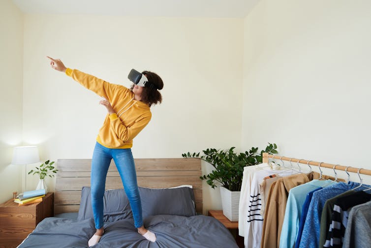 Teenage girl with a virtual reality headset.