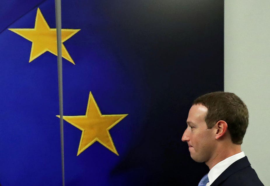 Mark Zuckerberg in front of an EU flag