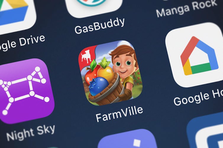 A picture of phone apps with FarmVille in the middle