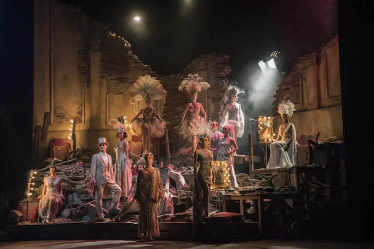 Dancers and performers on a stage.