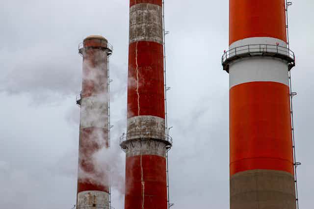 Red and white banded smoke stacks.