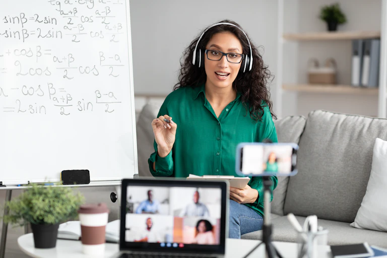 Lecturer wearing headphones delivering an online lecture