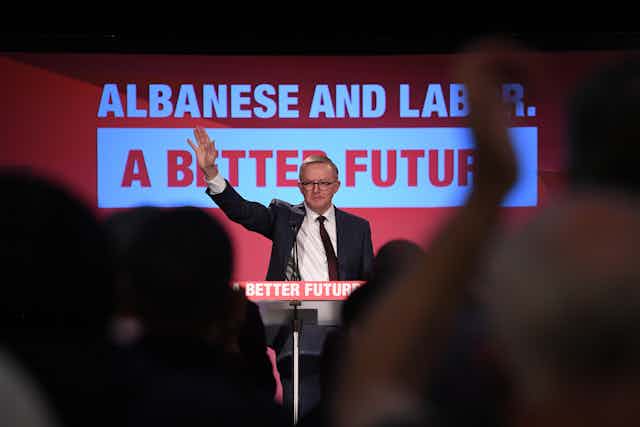 Labor leader Anthony Albanese waves to supporters at a rally.