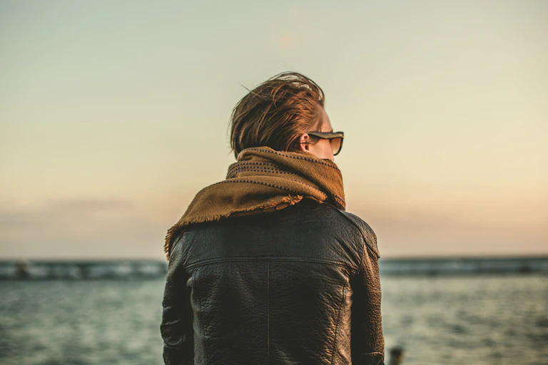 Woman looks out to ocean.