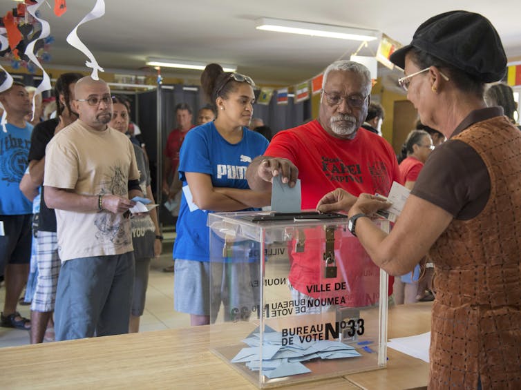 Voting at a polling station in Noumea.