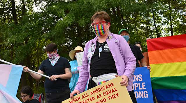 Transgender rights supporters march.