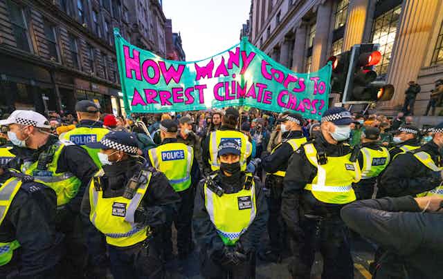 Police and climate activists