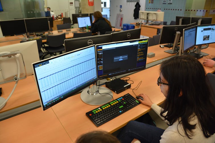 A student at a computer.