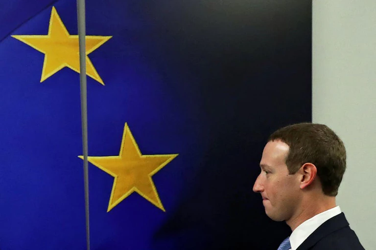 Mark Zuckerberg in front of an EU flag