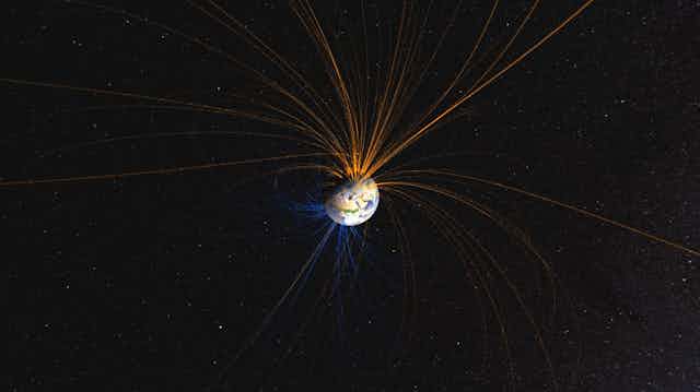 Représentation du champ magnétique terrestre ; les lignes sortent des poles et formes des boucles plus ou moins larges autour de la planète.